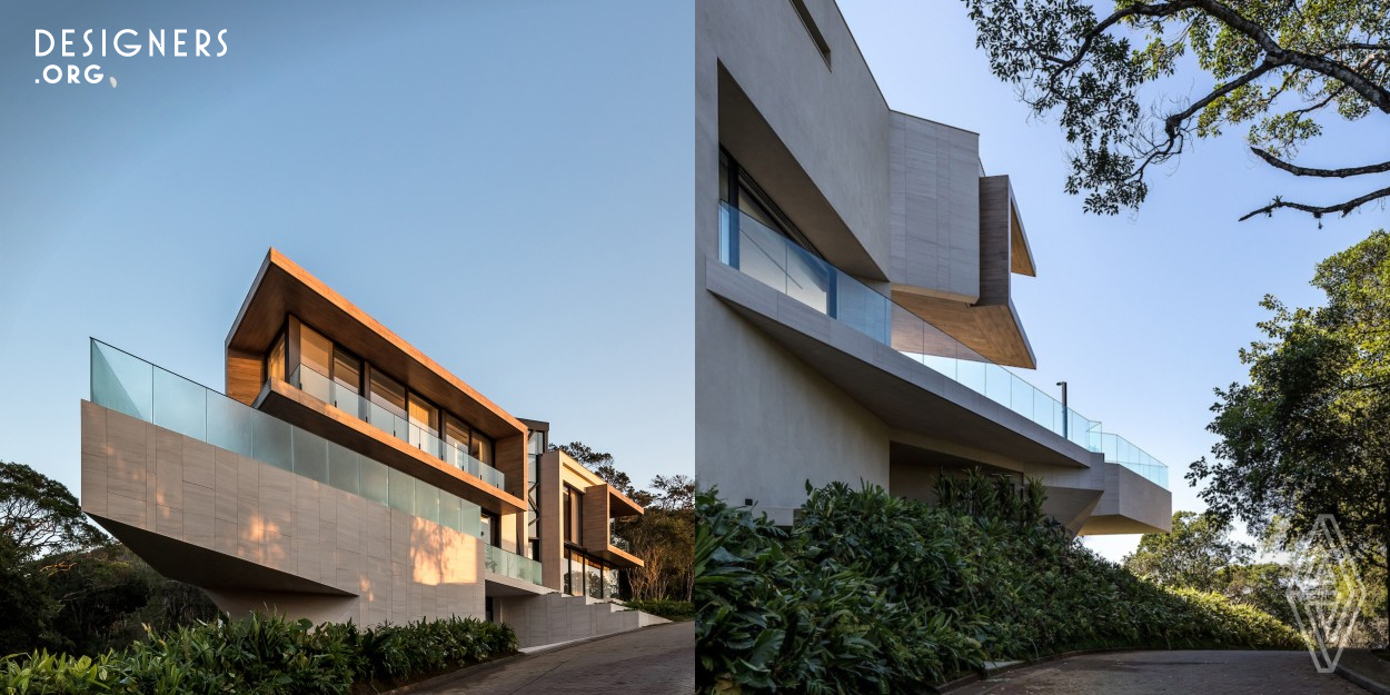 Panoramic House was designed for a family in search of a new lifestyle in the seaside. An atmosphere of belonging and identity, a panoramic view of the sea, elements of Brazilianness and an ecofriendly construction were some of the premises of the project. The building was camouflaged, in order to enhance the landscapes, through a contemporary architecture of pure elements and horizontal lines enriched by prominent points. Through parametricism, they carry originality and authenticity.