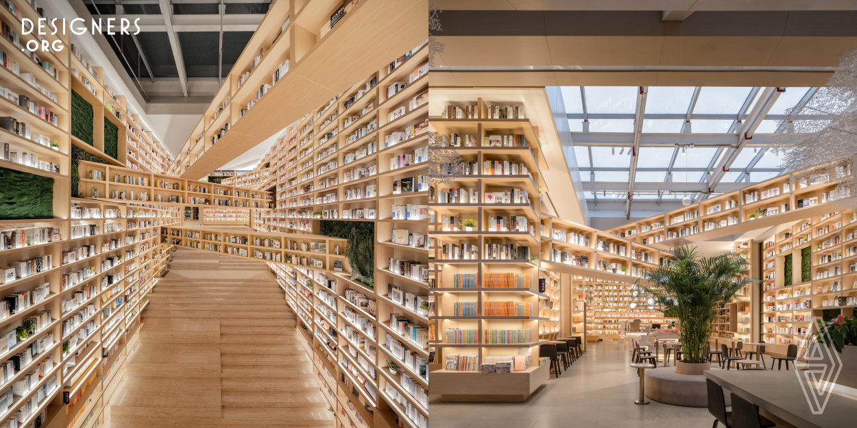 The bookstore represents Ningxia's cultural blend with its elegant design and iconic mid-air crossing bookshelves, reflecting diverse knowledge and interactions. In a high-ceilinged space, these shelves foster a dynamic ambiance, engaging visitors in a nexus of ideas. It transcends being just a book space, evolving into a lively intersection for literature, people, and cultures, thus nurturing a 'vibrant community' that encourages knowledge and cultural exchange.