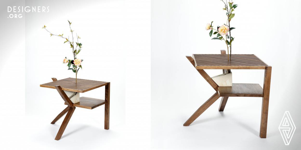 The Growing Table is made of walnut hardwood, which reflects the color of soil and creates a backdrop that makes plants more visible. The overall design is an intersection of dynamic movement and static posturing. The table provides a space where plants can grow and be viewed at the table in order to create a place for relaxation and interacting with nature. The tabletop surface diffuses light to create a greenhouse feature. Finally, the table is made for easy storage; it could be knock down into a 26” x 26” x 4” cuboids.