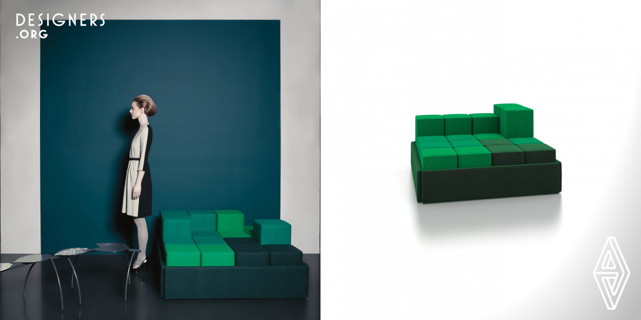 A modular sofa, constructed from small cubes, which can be adjusted in height by simply adding or removing cubes. With a small adjustment, the sofa can be given a completely different look. You can play about with the seat height, seat depth, place the seating individually or collectively, give it a relaxed look or an active look. Each cube can be ordered with its own upholstery and with a hard top cover which can be used as a table surface.