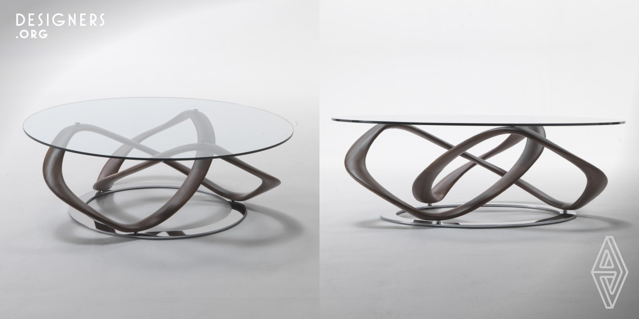 Personifying the symbol of perpetuity into a sensationally sculptural magnum opus, Infinity designer table collection by Stefano Bigi for Porada adapts both the shape and the meaning of this principle with compelling base and minimalist glass top. Paralleling the theory’s adaptation in cultural spheres, Stefano brings the realms of eternity into the world of modern design with his though-provoking interpretation of dynamics featuring sinuous lines that create an illusion of material pliability nevertheless as solid as the tables can be, being made of chrome, solid wood and glass.