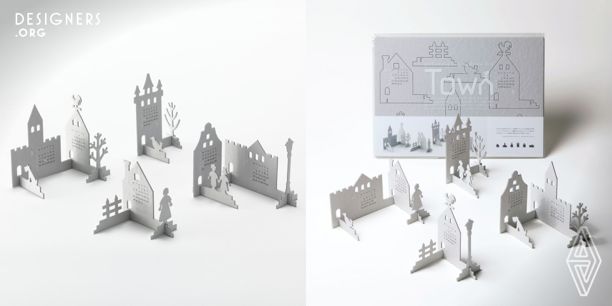 The Town is a paper craft kit with parts that can be freely assembled into a calendar. Put together buildings in different forms and enjoy creating your very own little town.  Life with Design: Quality designs have the power to modify space and transform the minds of its users. They offer comfort of seeing, holding and using. They are imbued with lightness and an element of surprise, enriching space. Our original products are designed using the concept of “Life with Design”.