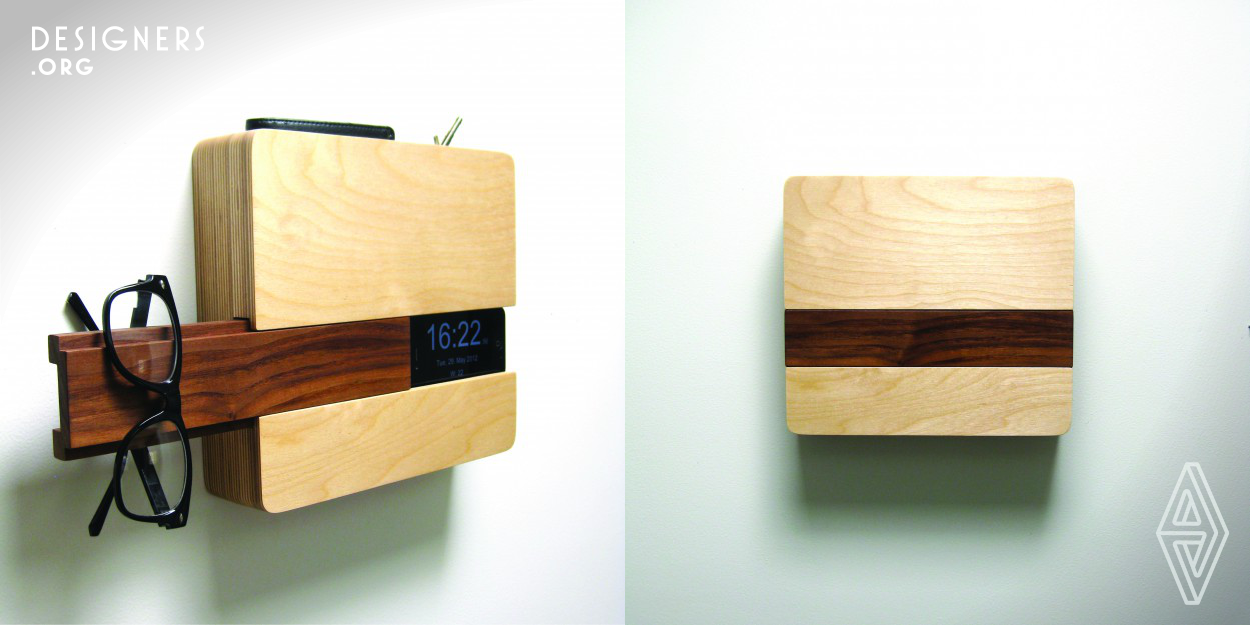 The Butler may have solved every busy person's and/or scatterbrained person's problem. This simple yet wonderfully designed piece will hold your keys, iphone, wallet, glasses, and anything else you can think of, all in one sleekly handmade spot. Hang it on the wall by the front door so everything is ready to go the next time you leave. The iphone slides in through the center slot which has a hidden space for your iphone charger. Handmade in San Diego, this functional design combines American Black Walnut and baltic birch.