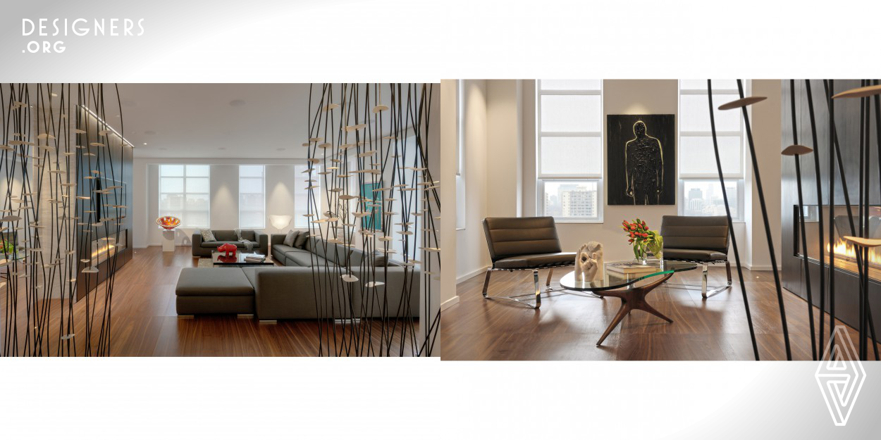 This 400 m² penthouse occupies an entire level in a new high-rise condominium in Downtown Toronto. The clients, husband and wife empty-nesters, requested a welcoming, contemporary living environment on a single floor, balancing public and private areas, with frequent opportunities for showcasing their cherished collection of art. The penthouse space, initially a near-raw shell, presented an exceptional opportunity to realize the clients' goals fully. The result: a sophisticated downtown home, with an atmosphere of warmth and informality, in a fully-modern design idiom.