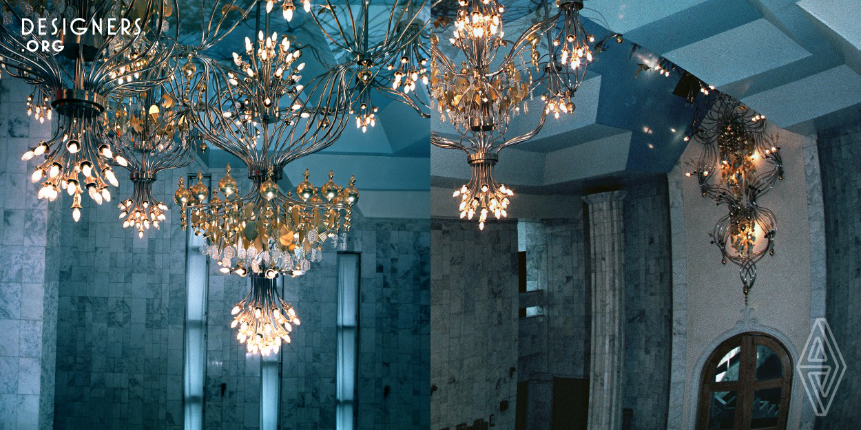 This arts - art object with lights on. Spacious room with a ceiling of complex profile, like cumulus clouds. Chandelier fits in a space, smoothly flowing from the front wall to the ceiling. Crystal and white enamel leaves in conjunction with the elastic bending of thin tubes create the image of a flying veil over the world. The abundance of light and golden glow flying birds create a feeling of spaciousness and joy.