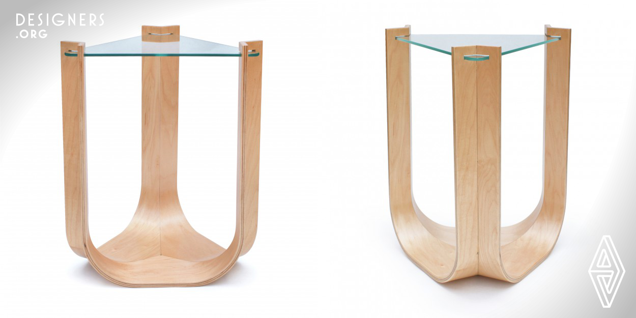 Seamless integration is the essence of the Una table. Three maple forms come together to cradle a tempered glass surface. the product of intense consideration of materials and their capabilities, sturdy yet airy in appearance and incredibly lightweight, Una emerges as the embodiment of balance and grace.