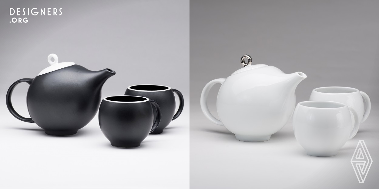 This seductively elegant teapot with matching cups has an impeccable pour and is a pleasure to partake from. The unusual shape of this tea pot with the spout blending and growing from the body lends itself particularly well to a good pour. The cups are versatile and tactile to nestle in your hands in different ways, since each person has their own approach to holding a cup. Available in glossy white with a silver plated ring or black matte porcelain with a glossy white lid and white rimmed cups. Stainless steel filter fitted inside. DIMENSIONS: teapot: 12.5 x 19.5 x 13.5 cups: 9 x 12 x 7.5 cm.