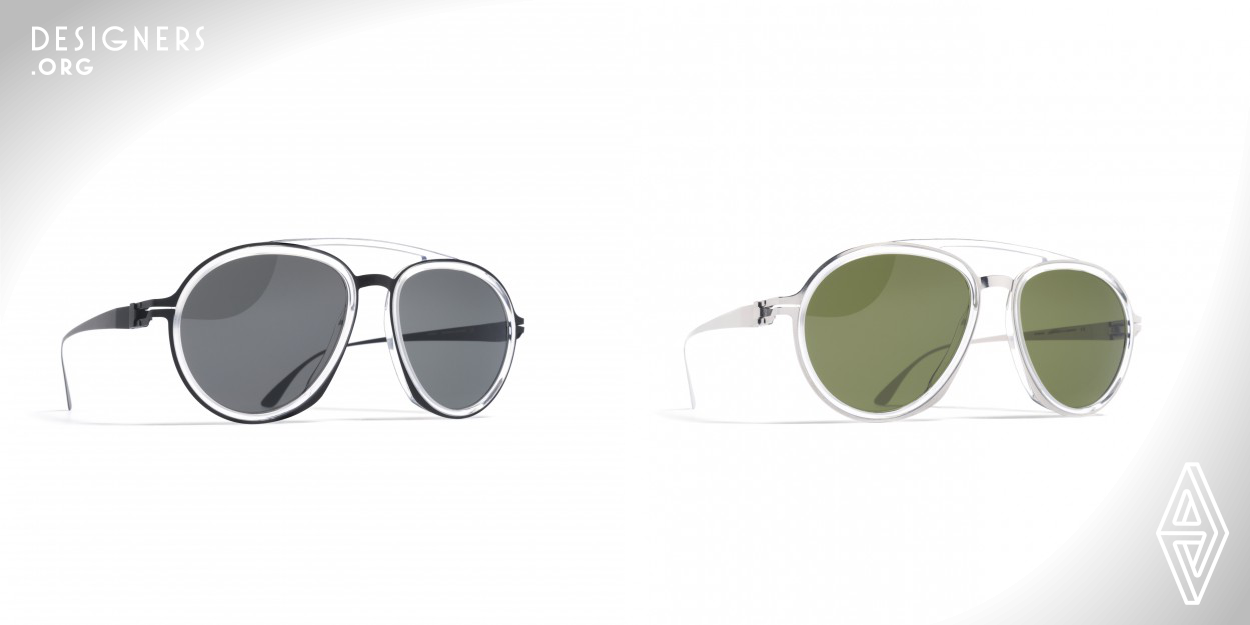 The progressive use of materials and the aesthetic created by a visible construction forms the basis of the MYKITA / Damir Doma design language. The frame DD1.3 is an avant-garde interpretation of the traditional pilot frame from the forties and fifties that propels the classic frame in a design characteristic of MYKITA / Damir Doma into the 21st century. The choice of materials provides a contrast by marrying delicate stainless steel with voluminous acetate. The sunglasses are a result of complex handcraft. 