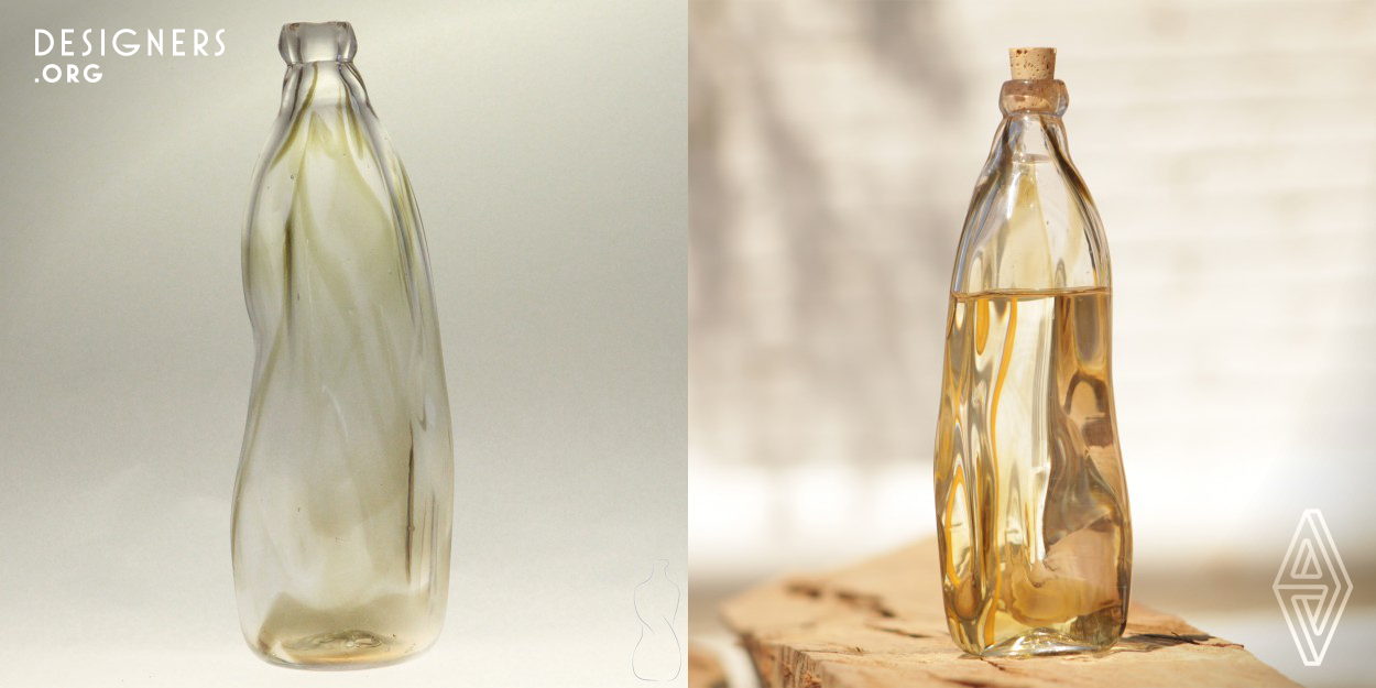 This is a hand made object designed by Arturo López, one of the crew members at Studio Xaquixe. He got the idea of the bottle when he saw a tree that looked like a couple hugging each other, and this made him think in how loved ones become one when holding each other with "pasión".
The glass used in creating the piece is 95% recycled, as is all the glass used at Studio Xaquixe.
The Furnaces used in the Studio are made by the crew and are fed with organic waste such as biodiesel or biomass processed to become methane gas.