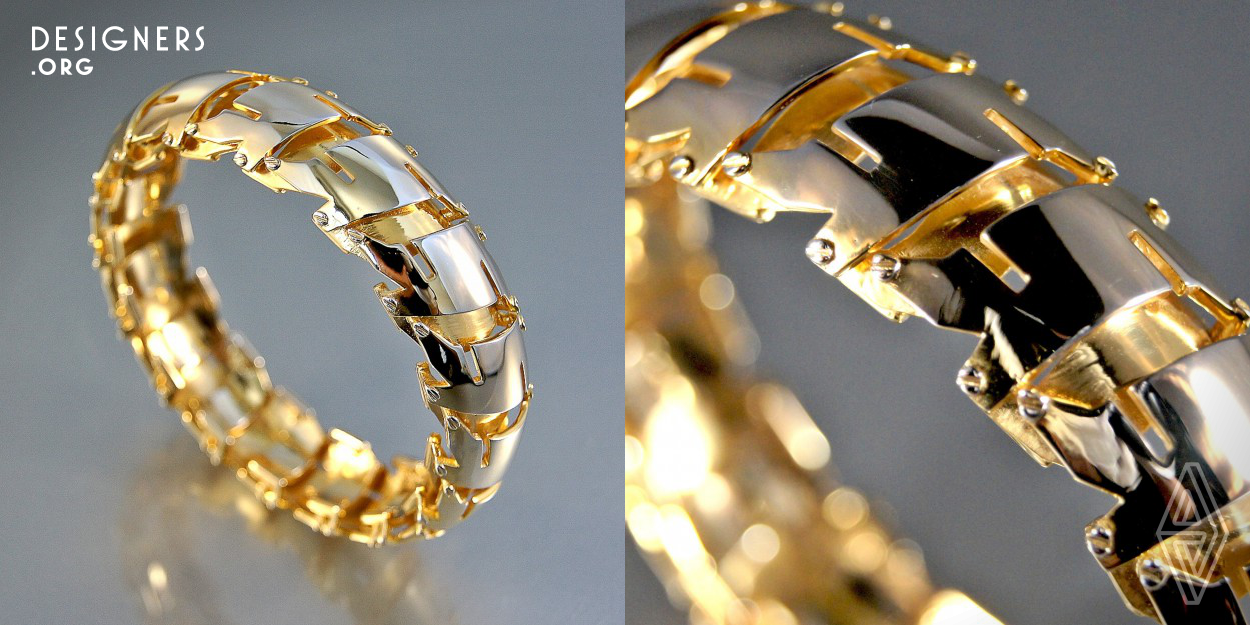 This bangle is comprised of multiple geometric figures, married into a new abstract shape that repeats in order to create its elaborate form. The design process pushed the limitations and error range of the 3D printing technique to achieve a dynamic form composed of simple elements. This piece is designed to be worn simply on either wrist.  