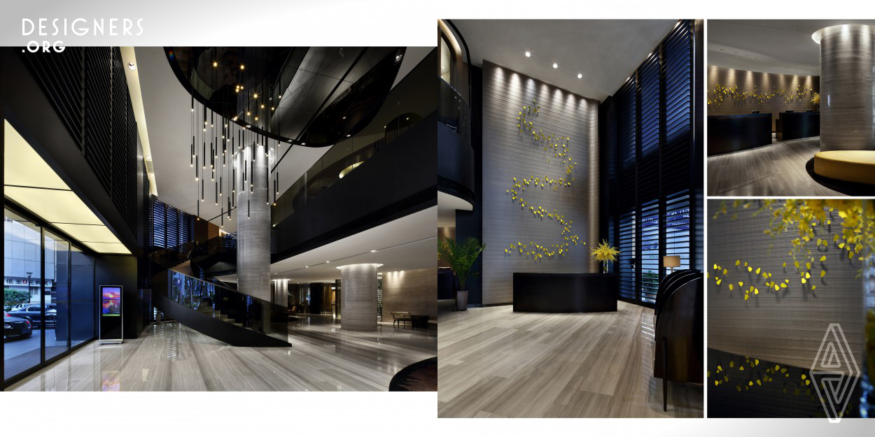 The challenge was to transform a well established business hotel and give a new boutique style image. The "Lively Metropolis" design concept was inspired by mutualism and energy, incorporating subtle curved lines with yellow dancing orchids. New illuminated curved staircases and modern chandelier modular combine to create a vivid centre piece of the double ceiling in the entrance lobby. All seating were designated in a pool like fashion with sleek lines furniture. The whole atmosphere is given a warm feel using contrasting neutral shades with sharp yellow dancing orchid as accents.