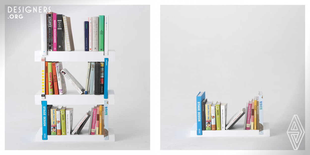 The Minimal Bookshelf is a simple storage solution that incorporates the books it holds in its design and construction. The bookshelf features grooves cut into both ends of a shelf, which the user can slot books into to serve as bookends. If your book collection is too large to fit on one shelf, a second or third can be added, with the bookends doubling as pillars to support the shelves stacked on top.