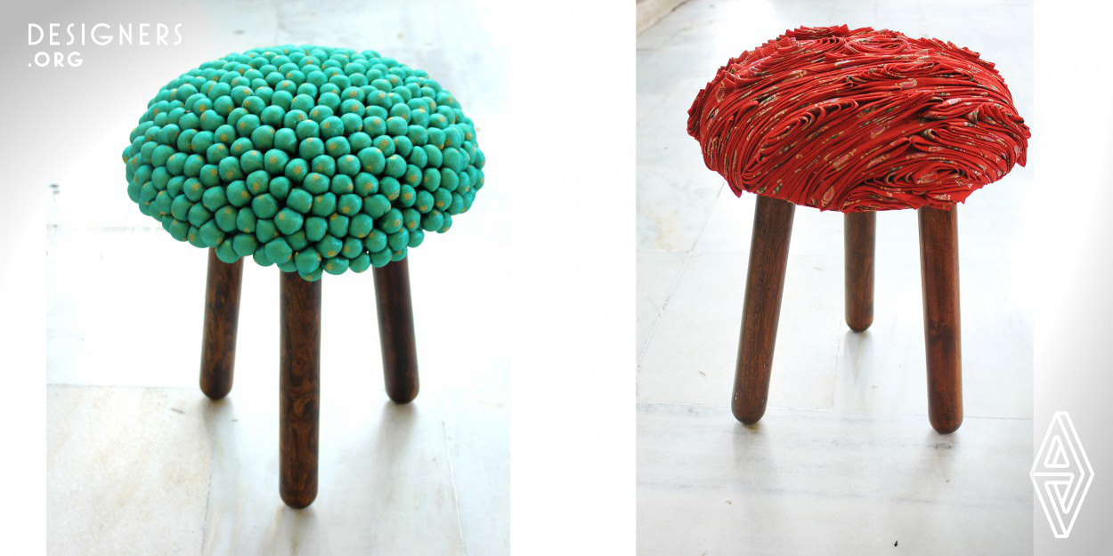 The up cycled and sustainable  Seating Collection is inspired from the discarded heirloom textile of Indian women. It is made converting old and discarded silk Sarees – bright and vivid draped garment worn by Indian women all across India, into sculptural seating options pairing it with locally found Indian varieties of wood. Royal Indian Turban - 'Pagri' Series, Pompom Series, 'Bindi'- Dot Series and 'Chamki' - Braided Series are a whimsical and quirky interpretation of the cultural context of the draped garment.