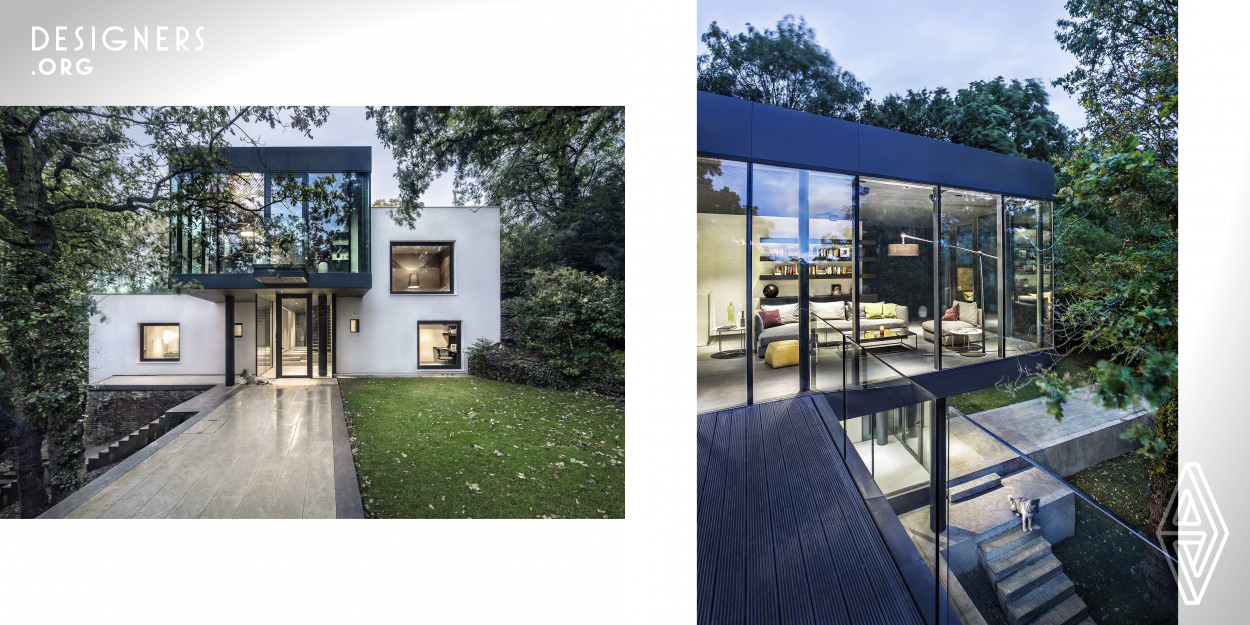 Redesign and Reconstruction of a House in Bromley, South-East London. The new design provides extra space and a better quality residence that interacts with the surrounding nature. The new insulation and glazing provides a more efficient and sustainable home. New steel structure added to the original brick and timber house. Added are concrete supporting walls and walkways to ground floor.
