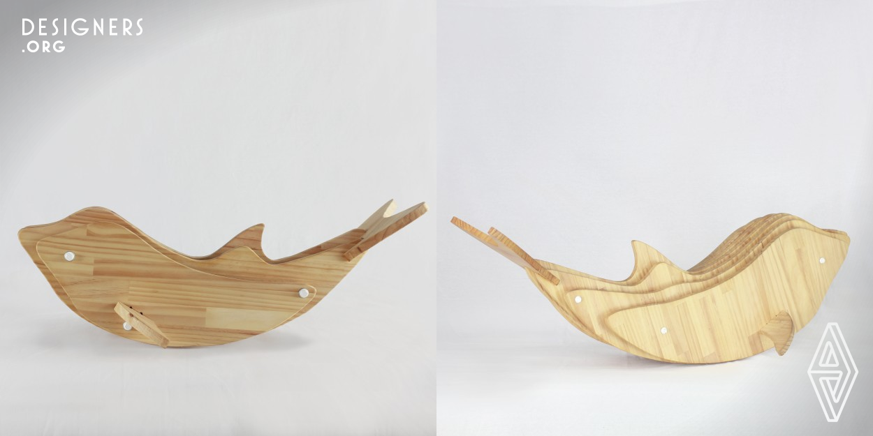 Inspired by the wild dolphins that play around Guishan Island in Yilan County, Taiwan, Rocking Dolphin is an ideal piece of furniture for children ages 1 to 3 that encourages young minds to explore their world through feel and touch. Made with 100% natural pine cut to precision with CNC fabrication, the dolphin features soft, sanded edges that eliminate the risk of abrasion or other injury. The dorsal fin provides the main seating area of the Rocking Dolphin, while the side fins offer a place where children can rest their feet.