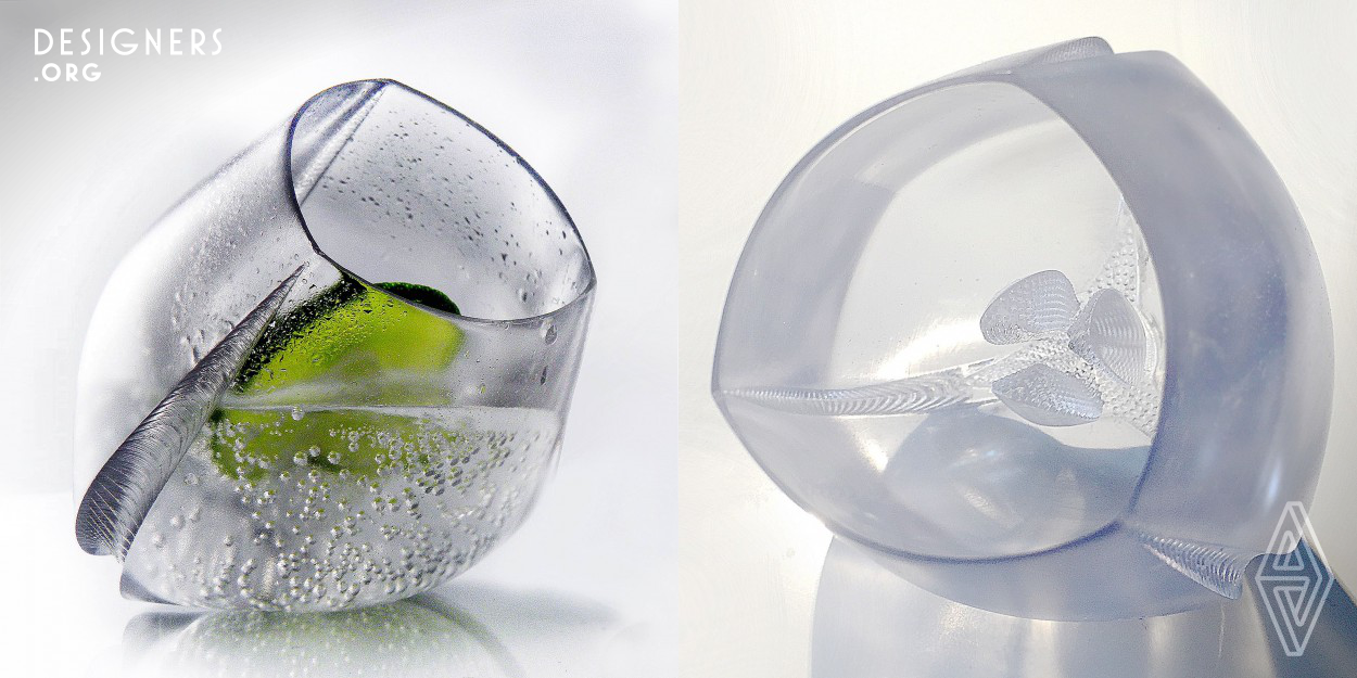 "Mesoglea" is a concept for a 3 d printed cup. Its form is inspired by deep sea creatures, the Mesogleae, to which also the Medusae belong. Similar top their translucent body plan, the cup has ac piece in the inner cavity that can hold a solid piece of your long drink, like a lemon for example. As the lemon is fixed by this central piece, the dissolution inside the drink is accelerated. Following the movements of the medusae, the beker can also be used inclined position, remembering thus of a floating medusa.It is made from 3d printed translucent filament plastics with coating.