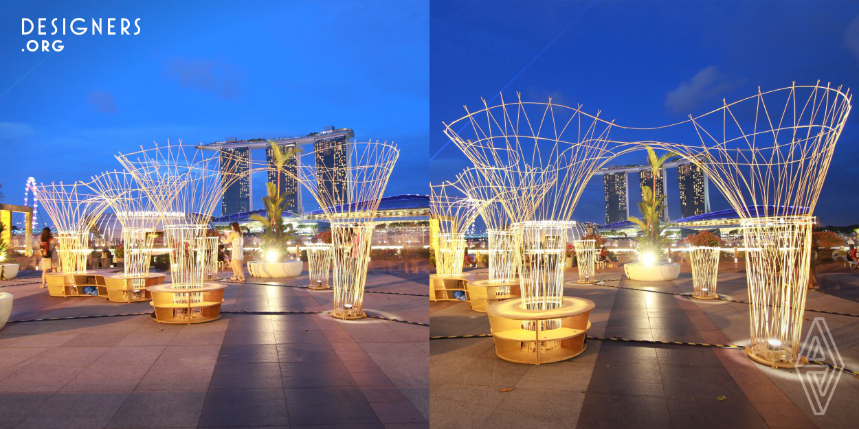 Inspired by traditional Chinese lanterns, Lightscape combines CNC fabrication with local materials in the form of a lightweight, luminous pavilion. Each of the pavilion’s ten columns is composed of crisscrossing bamboo dowels; in the four central columns, the dowels unfold into a 2.4-meter-high canopy. Ensconced within each column is a lamp that illuminates the bamboo lattice from within, creating a soft, delicate atmosphere in the evening. Located at Marina Bay, Singapore, the pavilion echoes both the vertical grandeur of the skyscrapers behind it and the undulations of the bay before it.