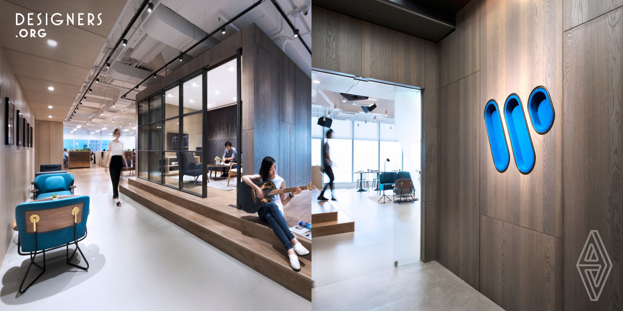 The brief of the project is to create a unique workplace that suits the activity of the music company, a 19,000sqft office for Warner Music in Hong Kong. The new design features a dedicated performance space for local artists, and encourages social interactions across the company. A storage display wall wraps around the main core, forming a continuous backdrop for everybody and physically connecting the spaces together. The metal and leather joinery details are a subtle reference to the company’s music heritage. 