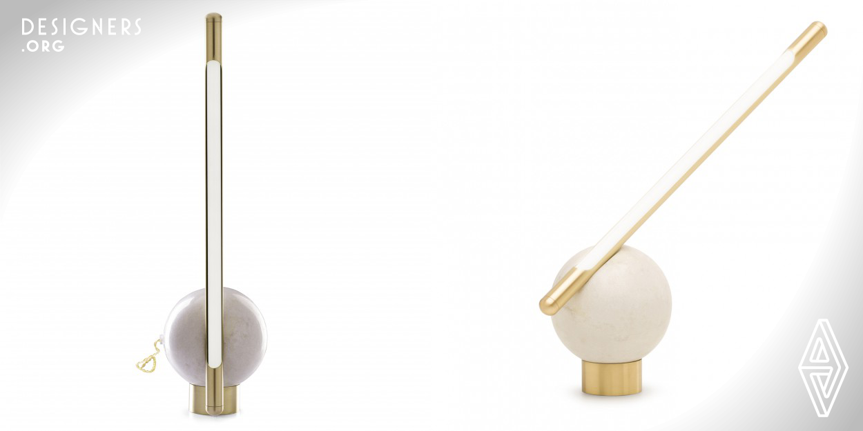 Bubble is a minimalistic table lamp, designed to be interactive with the user. Executed with a sphere carved from a block of marble found in the state of Espirito Santo, Brazil, has a brushed brass rod with a LED lamp inside. The adjustment is made when the sphere is rotated over the brass ring of the base. This simple support system allows numerous positions and placements together giving a dynamic character to this lamp. To produce the Bubble, various types of marble and metal can be used and mixed and the inspiration came from the well-known child's game by blowing bubbles through a straw.