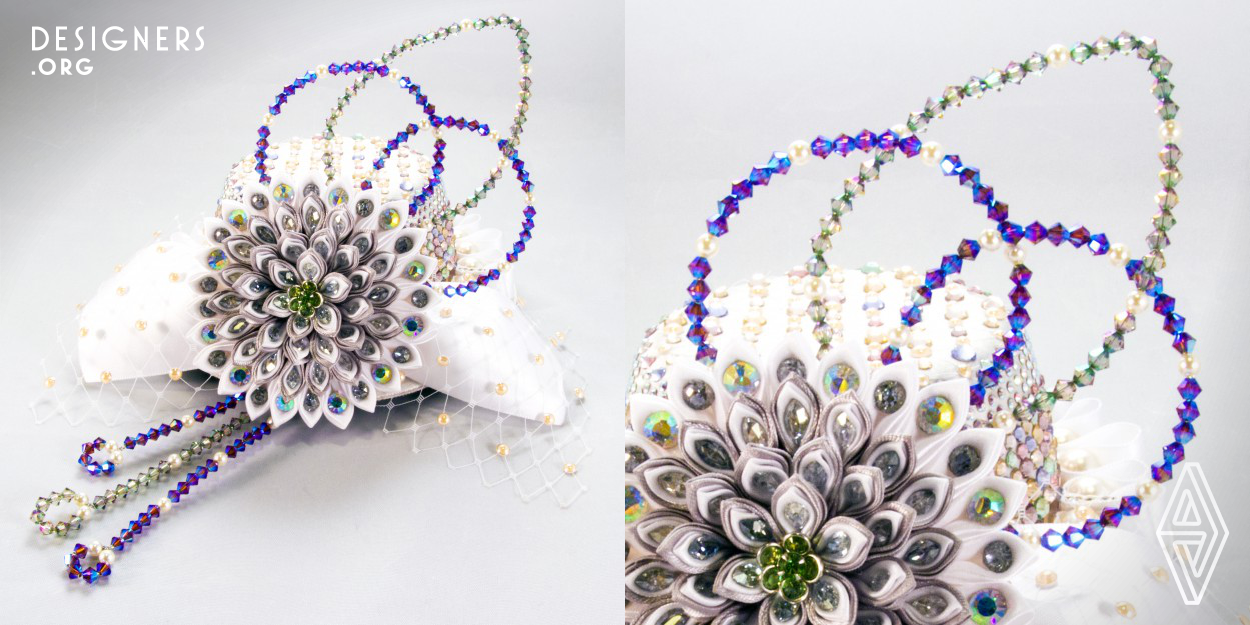 This head jewelry is created by arranging Japanese traditional techniques, Tsumami-zaiku and Mizuhiki-zaiku with Swarovski crystal. The inspiration of wedding cakes and beautiful decorative cakes bring up the idea of Mizuhiki that plays an important role in Japanese culture as a symbol of affection, warmth, and togetherness. Mizuhiki knots are closely associated with the Japanese word MUSUBI (meaning Connection or Tying) because tying a Mizuhiki knot connects people and ties them together. 