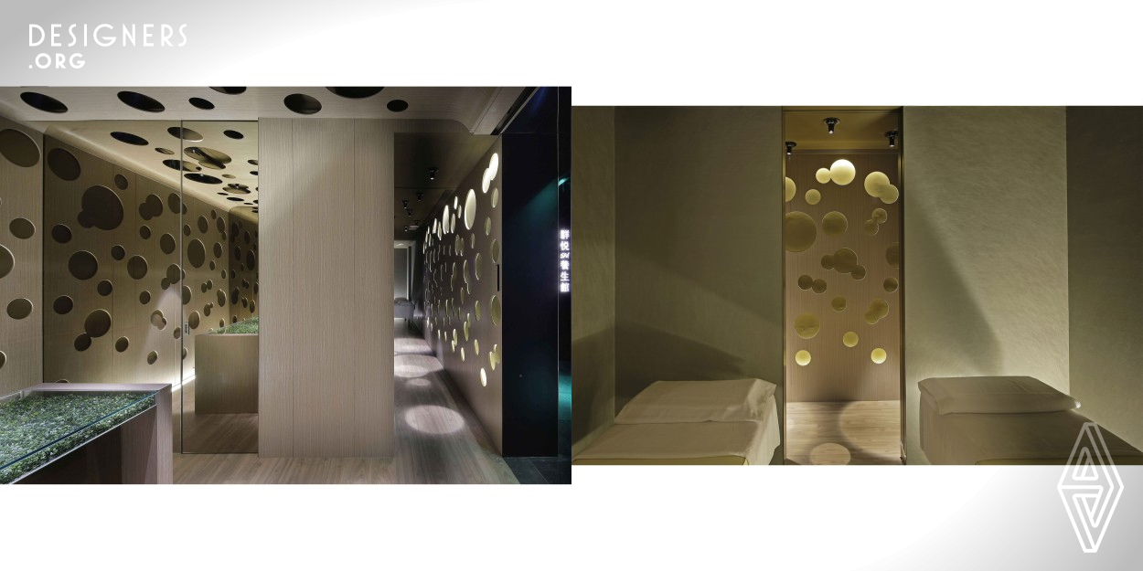 This project divides the Spa space into two main sections for women and men, with each section featuring a separate reception desk. It employs the Chinese design concept of Yin and Yang, of the Void and of the Concrete, wherein the embryonic round dots in the two sections overlap and permeate each other, thereby characterizing the space as a whole.