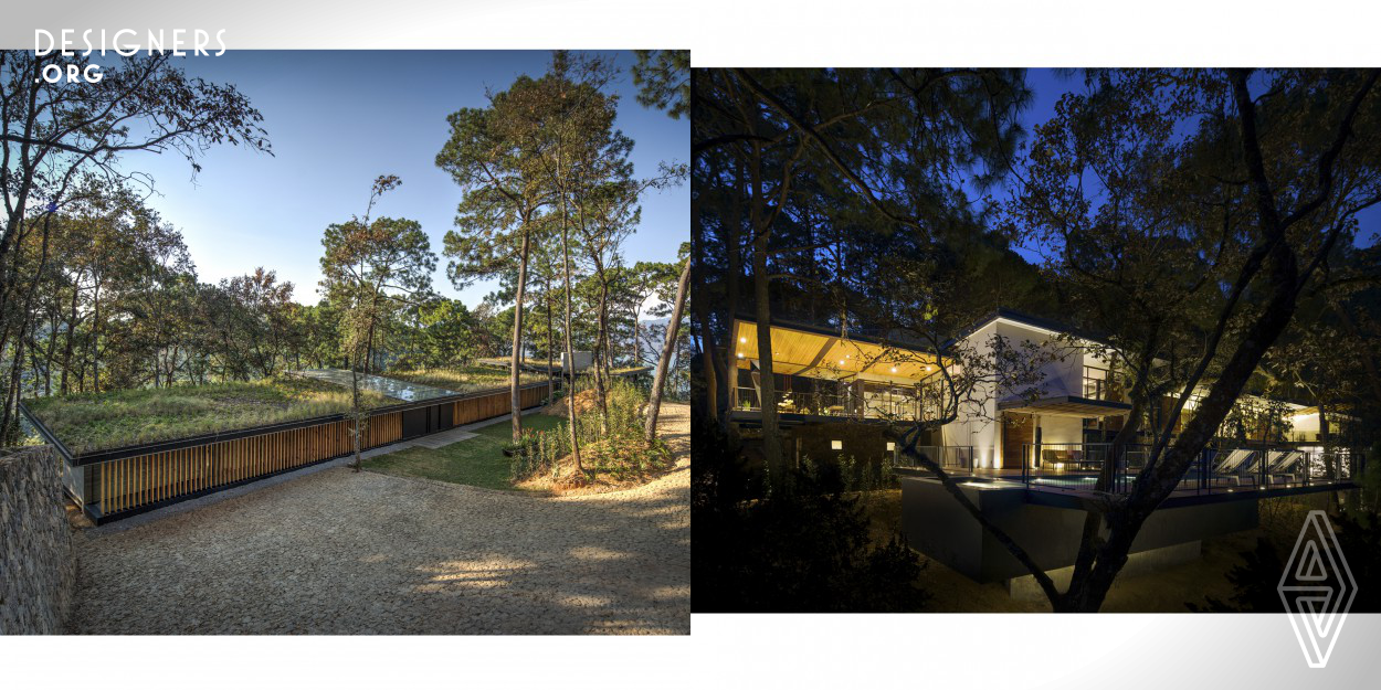 The design of this house responds to the orientation. The south east facade shows itself linear and dominated by a wood curtain that helps let the sun rays through in the morning in a diminished way, giving the necessary warmth to the hallway. In visual and formal contrast, the south west facade tops towards Valle de Bravo's lake, it is extended in an open covered arrangement that reinforces the intention of living in a holistic manner with its environment and users.