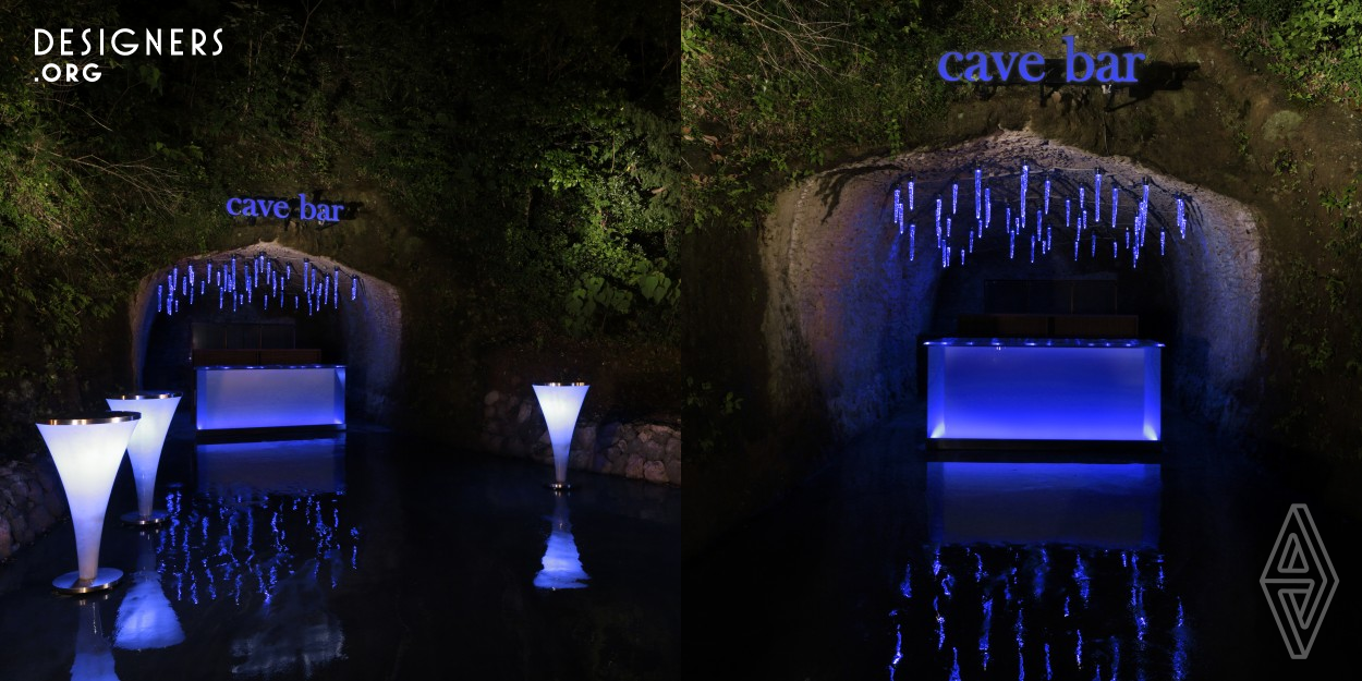 This bar is located in the site of a ryokan (Japanese hotel) and it is for the guests who are staying. They only designed to highlight the beauty of nature and turned the cave into an unforgettable bar. The cave was left untouched after the former owner gave up making a tunnel and nobody saw the beauty hidden in the cave. They were inspired by stalactite cave. How nature creates stalactites, and how stalactites makes a plain cave mysteriously beautiful. With the simple design and the original icicle-like glass lights, supermaniac wish their design to be stalactites for the cave.