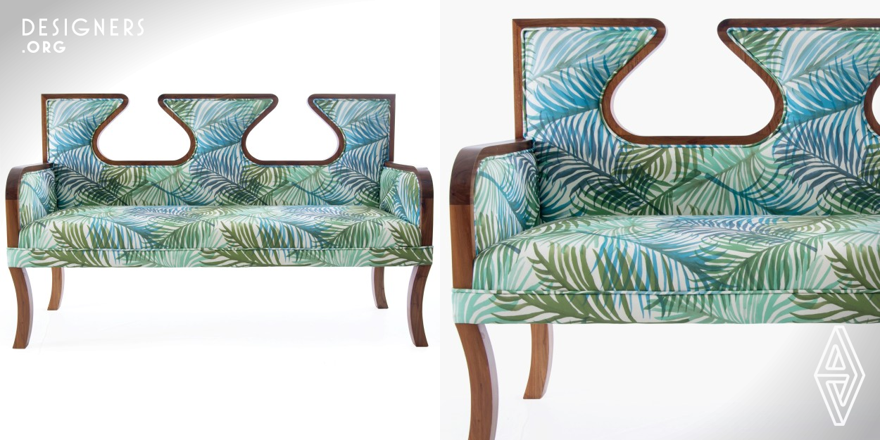 This settee is made of Tanzanian hard wood known as "mninga" frame,high density foam,pirelli belt and printed fabric.It is made to order and can be customized with a different fabric options which are printed in house .The curves of the design are inspired by the Ngorongoro crater which is found in Tanzania .This setee is suitable for any residential or hotel interior and can be placed in the entry,lobby or living room.