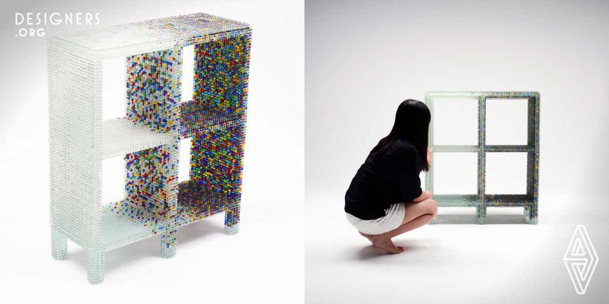 The design was made with a glass marble called B DAMA in japan with a context of a defective item. Kairo Kusamoto attempted to change the meaning that the marbles have, especially by using B DAMA used in Japan for furniture decoration. The design was created by a defective material, so this shelf was partially treated to remove the glass marbles on the surface, to include that meaning and context in object. This design can give an impression that it is not only one of the tool and decoration of interior, but also the strength of time-consuming handcraft.
