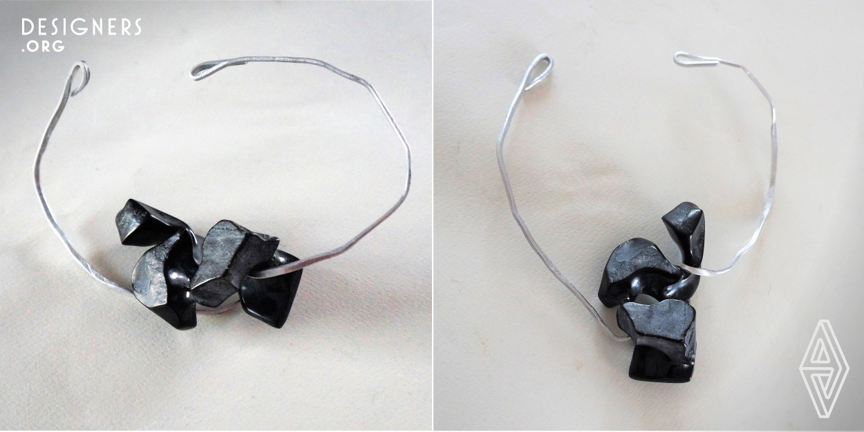 These are the small sculptures made with black natural stone but same parts of it are polished. The pendants are reminiscent of fragments of skeleton, bones which alternated fullness and emptiness create ever-changing play of light.  It is possible to shape the wire through the holes on the stone, it can be change time in time according to a different scheme of composition and that creates a custom jewelry according a taste and mood of the moment. The black marble is very elegant stone. The contrast between the deep black and lighter colour of the skin makes an particular, attractive effect. 