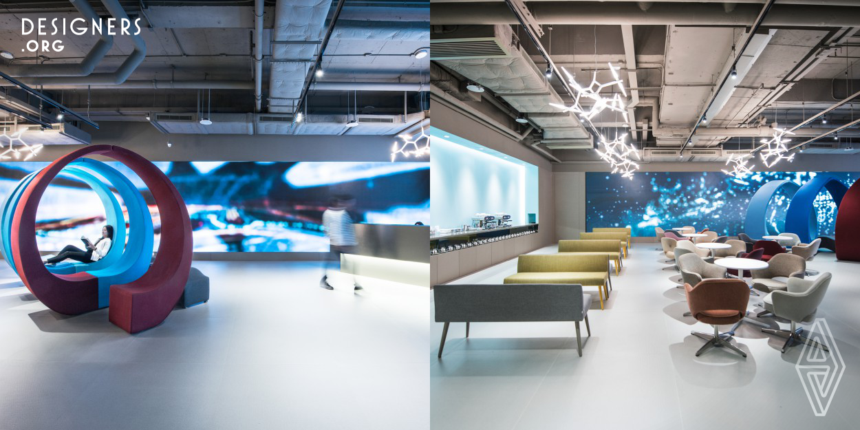 The new welcoming space for a logistics company in an industrial building in Hong Kong makes reference to museum spaces, installed with design furniture and a 9m long full height video wall for film installations. The films would transform the atmosphere of the space to cater for different events. Over sized European ceramic floor tiles have been used to create an earthy finish.