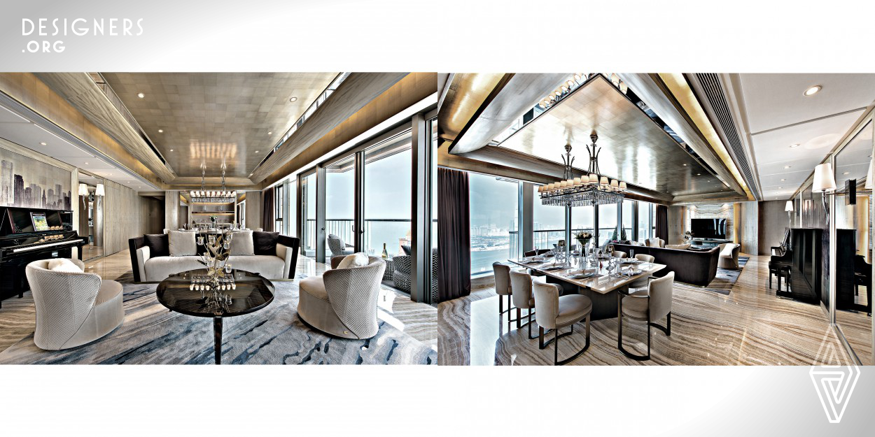 This 2,476 sq.ft. unit, located in a high-end and luxurious area, is embraced by the signature sea view of the Victoria Harbor. The designer acted as a gown tailor and transformed this unit of high value into a beauty wearing a custom-made evening gown by using materials such as gold leaf in champagne gold color, figured maple in grey-wooden tone and granite with unique vein lines. In addition, one of the highlights in the design was the implementation of the Smart living System, providing all-in-one control of the electrical devices to bring daily convenience to the owner.