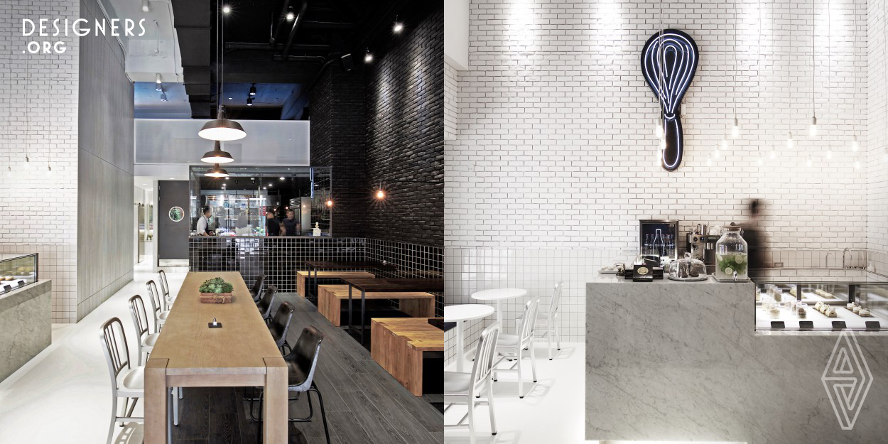 A restaurant with subtle and stylish design, is also a stunning result when the chefs of pastry and cuisine encountering with designers. The design elements are as simple as the name only in two letters. At first glance, the space is divided into two parts by a highly contrast of black and white colors. To make these matching perfectly, designers extend the same materials from the ground to the ceiling with only two colors. At the same time, create a kind of dark and shine mystery.