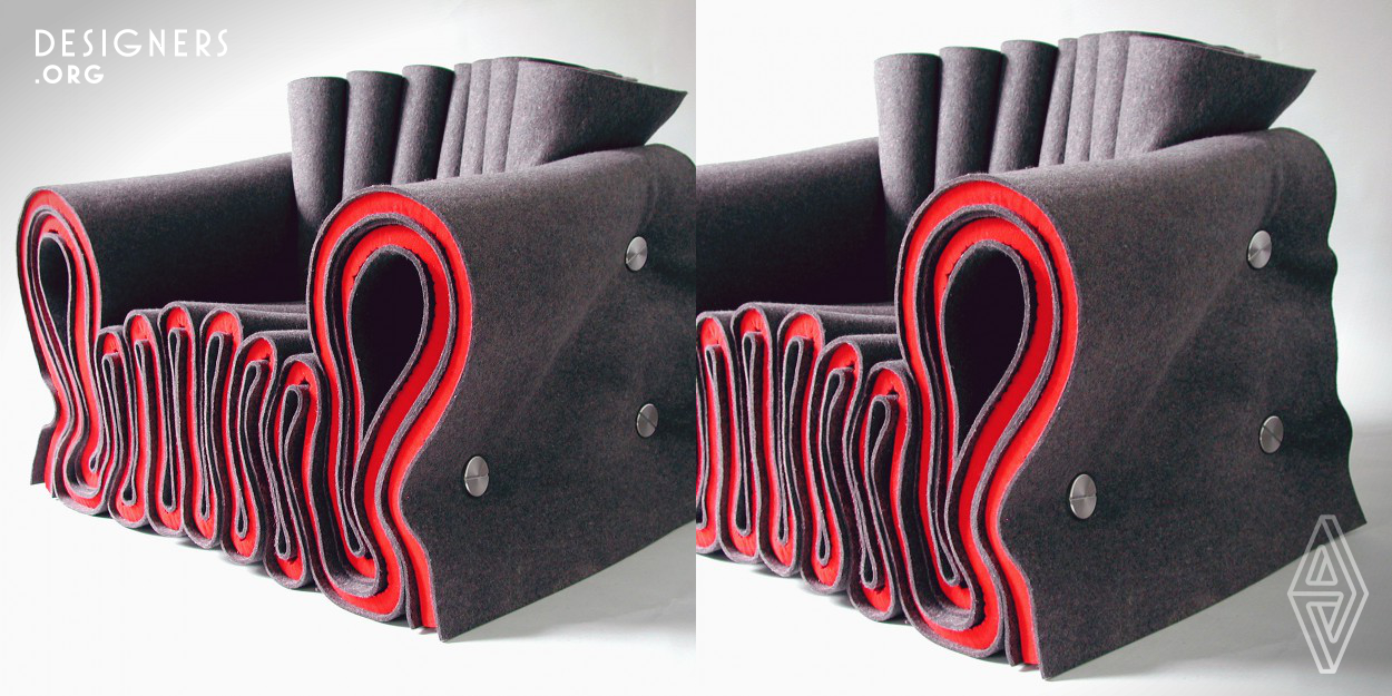 The Felt Chair Joseph is composed of six rolls of interwoven felt, pressed together with stainless steel fasteners. The chair uses the structural properties of felt to create a soft construction. It does not need a cover or an inner frame as conventional upholstered furniture, because the outer appearance is the outcome of its integral construction. 