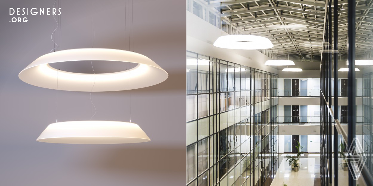 This ring-shaped LED pendant light, which is 1,500 mm or 2,000 mm in diameter, was conceived as a lighting solution for the public sector. Its antiglare, white body diffuser, with a high light transmission of 85-89 per cent, produces a very intense beam of light, which makes sure that even rooms with very high ceilings can be fully illuminated. Its long service life and the avoidance of light sources which require regular replacement are further reasons for its installation at difficult to reach places since maintenance is minimal.