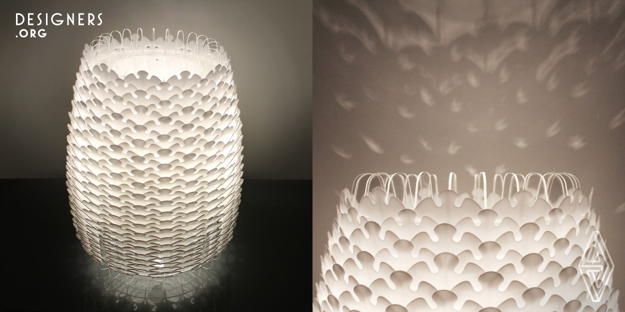 Designed as a decorative light, the Mi-480 deals with the idea of a textured skin, creating layers of transparent, translucent and opaque patterns. The gradients of light and shade that result, give the surface a sense of visual depth which changes depending upon the viewing angle. 480 pieces of acrylic, varying in size are illuminated by a single light source, located in the centre. This further helps create the illusion of a richly textured skin. Carefully placed gaps in the skin allow for rays of light to escape through, creating their own patterns onto the surroundings.