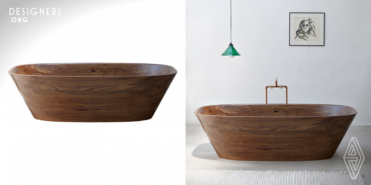 The Shell bathtub is carved from a solid block of aromatic walnut. With extremely high precision and a great love of detail, this concept is at the edge of what is possible – a wood bathtub cannot be made any more delicate. The exacting production process includes precise positioning of every corner and curve, and the ergonomic optimization of every radius and incline. The sophisticated drain and overflow lie flush with the surface of the bathtub, disappearing into its form.