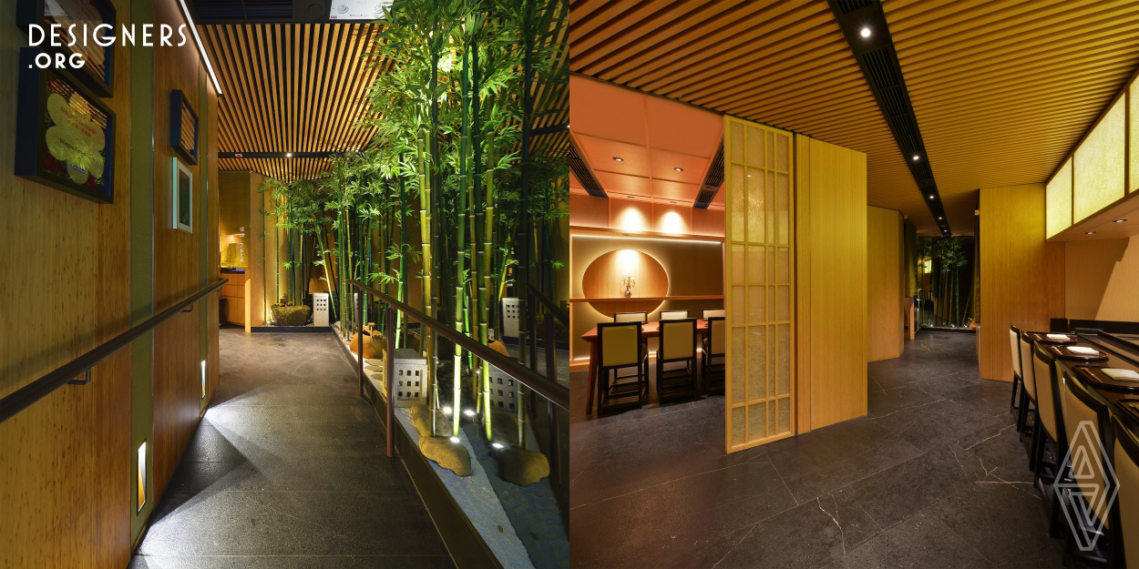 Kaiseki Den by Saotome, employs distinctive Wabi-sabi design elements of simplicity, raw texture, modesty and nature to exemplify Zen meaning behind Kaiseki cuisine. Shopfront is built with natural composite wood strips giving a three-dimensional visual effect. The entrance corridor and VIP rooms with Japanese Karesansui elements evoke imagination of being in a peaceful sanctuary undisturbed by the hustle and bustle of the city. The interior in a most simple layout with minimum decoration. The clear-cut wooden lines and translucent wagami paper with soft lighting keep a spacious feeling. 