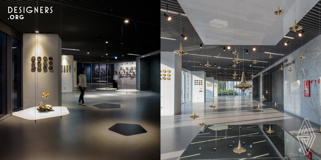 The exhibition space is designed to feature the metal products with advance tool usage. It is located at the MOEA innovation center in Kaohsiung city, Taiwan, the “Float” exhibition space incorporates the kinetic movement of gold polished metal pendants and pentagonal floating display shelf. The design intention is to create overall floating condition for the display area to represent lightness, which is relatively hard to connect with metal usage. 