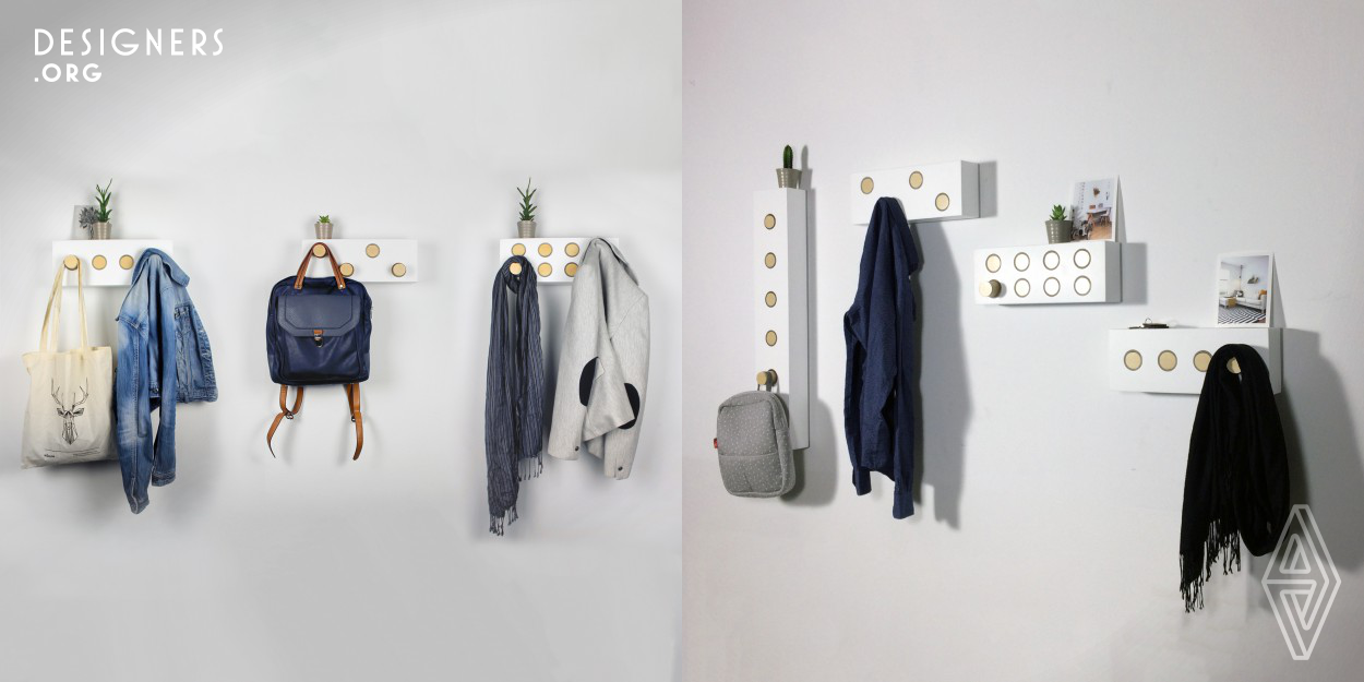 Kollen Tryk is an interactive wall hanger that allows the creation of different compositions depending on the user’s needs. The wooden-made product has a rectangular shape that contains a serial of flush circular buttons, the hangers, that the user distributes in order to his/her needs. When you press one of the buttons, it protrudes from the plane and you can use it as a hanger.
