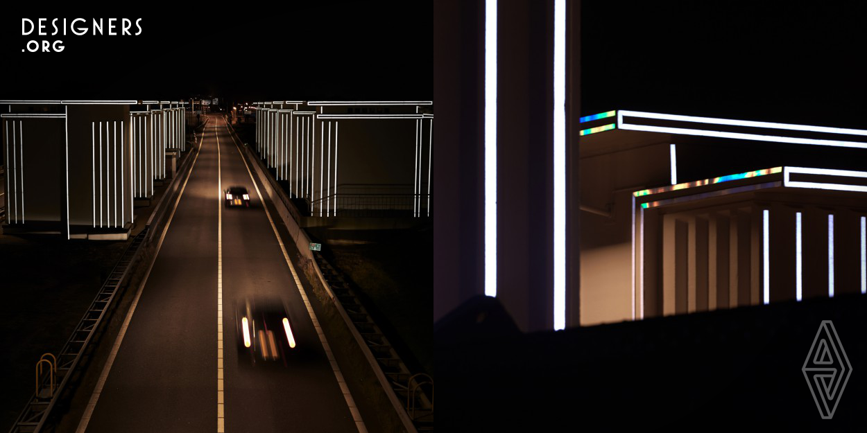 GATES OF LIGHT brings the monumental structures on the Afsluitdijk (legendary Dutch dike built in 1932) back to their former glory. In the dark, the architecture of these structures is illuminated by the headlamps of passing cars, reflecting the light through small prisms. If there are no cars on the road, the structures are not illuminated. This way of using light requires zero energy and does not contribute to light pollution.