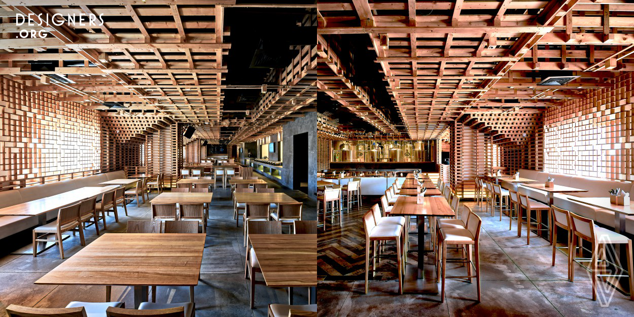 Hospitality design is a challenging area where the interiors need to stay fresh and appealing with the future trends in design. Pallet is a microbrewery that was designed with this thought. Designers have created an experience through fusion of sustainable and Natural Materials with straight lines in contemporary design. Recycled wooden packing pallets are the highlight of the design. Various sections that are created via partitions and wall treatments is achieved by play of number of pallets acting as a module to generate patterns. Overall it gives unconventional international look.