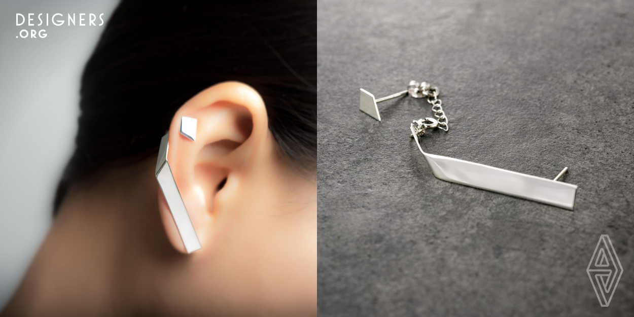 Unlike the design of single piercing earrings where the form of an earring's main purpose is to be aesthetically appealing, the form of multiple earrings had to accommodate different ear sizes and various distances between ear holes. The main body of the earring through its simple form fits harmoniously with the ergonomics of the ear. The spring at the end of the piece connects to a chain at the back of the matching cartilage stud, this gives flexibility to adjust the earrings set to various ear sizes and distances between the piercings. 