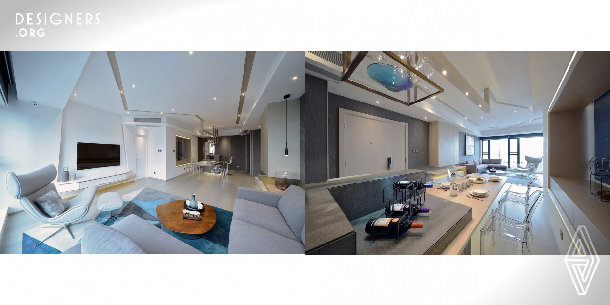The design of this residential project began with the dining table that seems to be floating in the air, yet such distinctive feature is more than just an eye-catching piece. It is a 1.8 meter dining table without four legs with lighting effect but supporting objects more than 200 lb. Due to the constraints of existing layout, structural changes could hardly be made to expand the entrance foyer and dining area – which is quite small in proportion. The designer is therefore introducing an out of ordinary fixture that could help enhance the overall spaciousness and offer a surrealistic feel. 