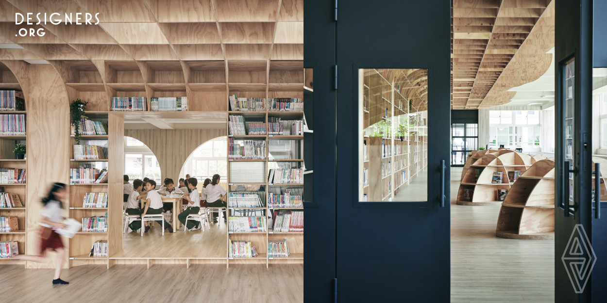 It's really difficult to change the reading space in Taiwan's school. So, the designers  tried to propose a separated space concept for school. First, to make sure the entry space ( collaborative classroom corridor) become a charming reading area welcoming students, so the designers  use the wood framed shelves to create a book wall and pebble. Second, to connect the three classrooms with different functions. Third, to open the original teacher office into a reading corner. The designers created a library very different from the others in Taiwan, and gave the school better images.