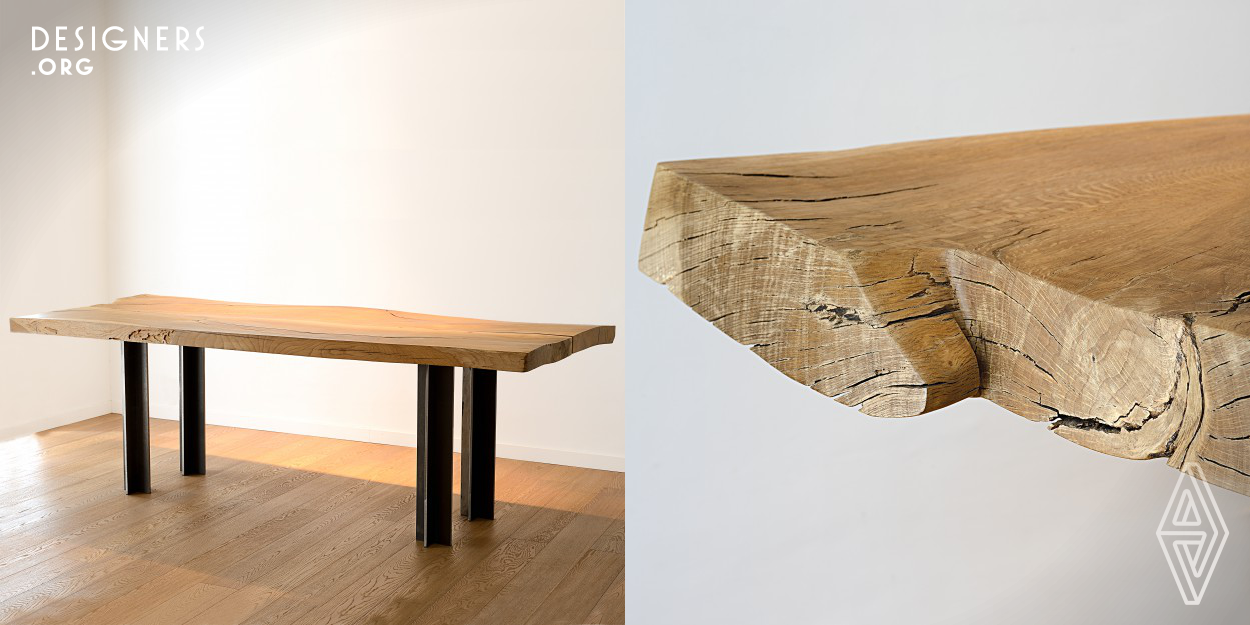 The Memory table shows itself naturally. The strengths are the design of the iron legs and the solid oak top. Each leg is formed by two slabs shaped with lasers and wedged together without welding to form a cross-shaped profile with four equal sides, a Greek cross profile. The wooden top is obtained from two 6 cm thick slabs obtained from the same oak and positioned so that the veins form the famous "open spot". The wood shows the signs of aging that remain a trace and memory on the table.