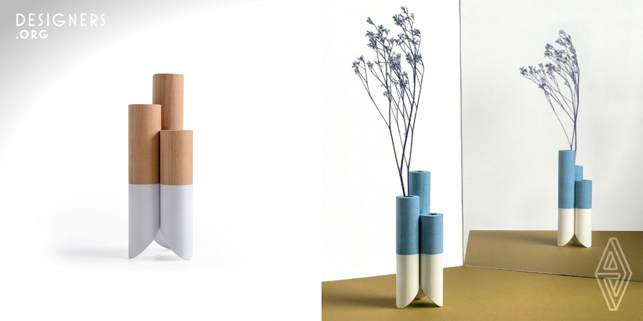 Just like a flower - a wooden stem and a colorful coating of your choice. Whether on its own, with a single bloom or in a bunch, the new and refreshing flower vase will bring the blossom into your home. The minimal designed vase, inspired by the "Math Of Design" methodology, comes in several materials and sizes and it can also be customized by picking colors, materials and even different producing technologies. 