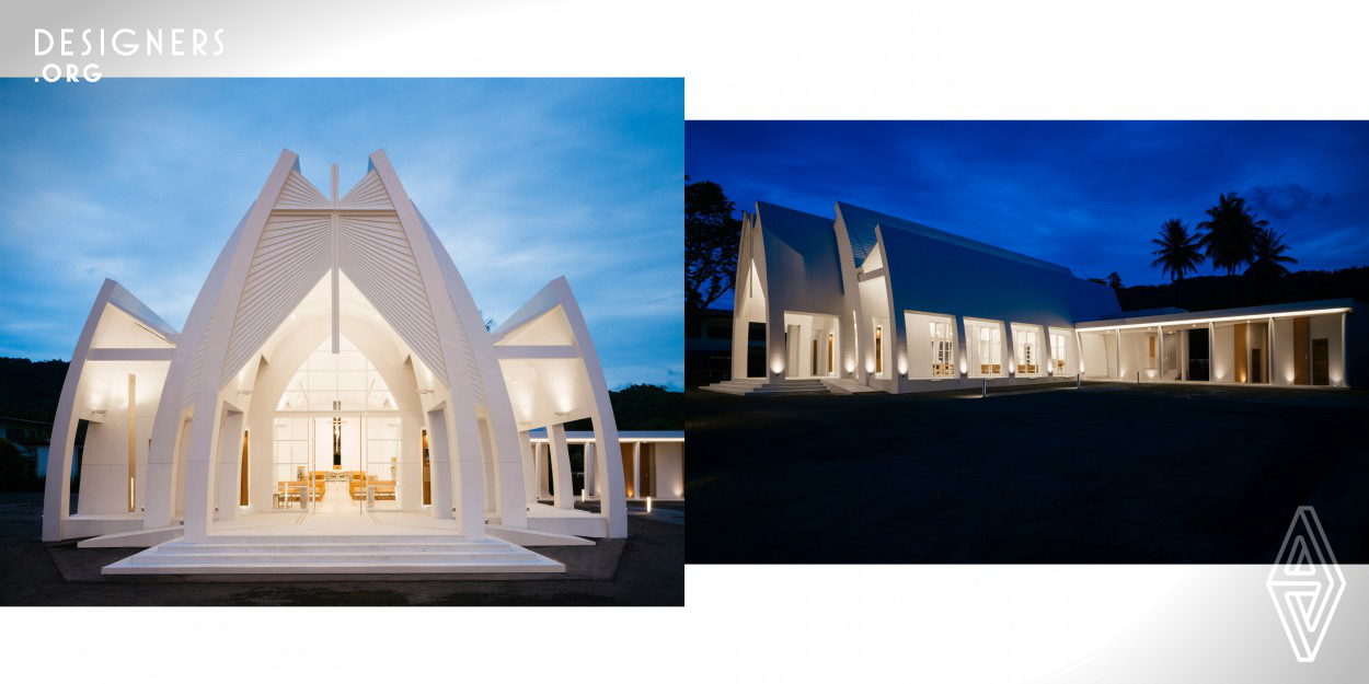 Given the extension of Catholic community and the increasing in tourist in Samui island, Suratthani. Mary Help of Christian church exterior was designed in a combined form of praying hands, Angle wings and the Rays of the Holy Spirit. Internal space, security as in the mother womb. By use of the long and narrow light void and a big light weight insulation concrete wing running through the light void were built to create a shadow that keep changing with time yet retains the interior comfort. Minimize the symbolic decoration and use of natural material as humbly peace of mind while praying.