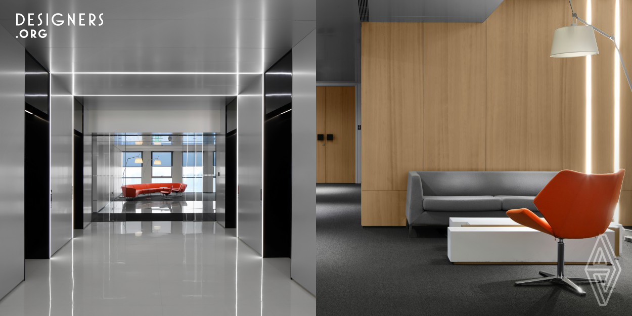 Located in Metropolis, a top class city complex built with global vision, Jianfa Group HQ achieved a minimalist, lively and modern office space that showcases strong sense of contemporaneity and technology. Black-and-white is chosen as the tone of the space to express sublime simplicity, professionalization and rationality. The careful selection of office furniture consists a range of warm colors of orange and red, which compliments the space with positive, bright and warm vibes. Environmental friendliness is a primary design principle.Lighting design of the space is also remarkable.