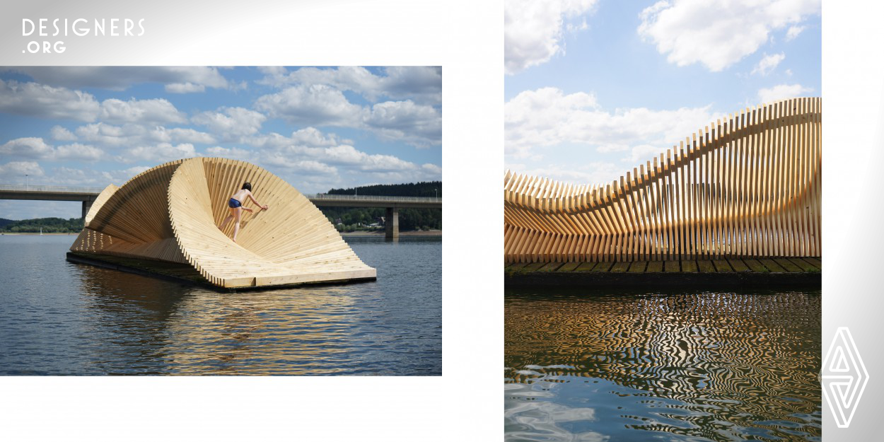 This floating pavilion is part of the art exhibition ‘odyssee’ on mohnesee lake, Germany. The exhibition featured twenty-four artists who were asked to make pieces on the lake. Named ‘circe’ after the seductive witch from greek mythology, the pavilion provides a resting place for visitors as they swim from artwork to artwork. The theme of transformation takes shape through 278 identical pieces of spruce that turn and shift to create forms that are alternately organic and platonic.